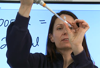 DNALC educator demonstrates using a micropipette